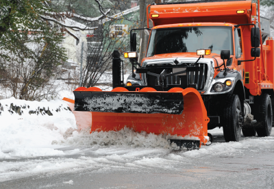 Snow plow clearing a road